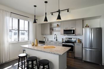 Full kitchen view with stainless steel appliances